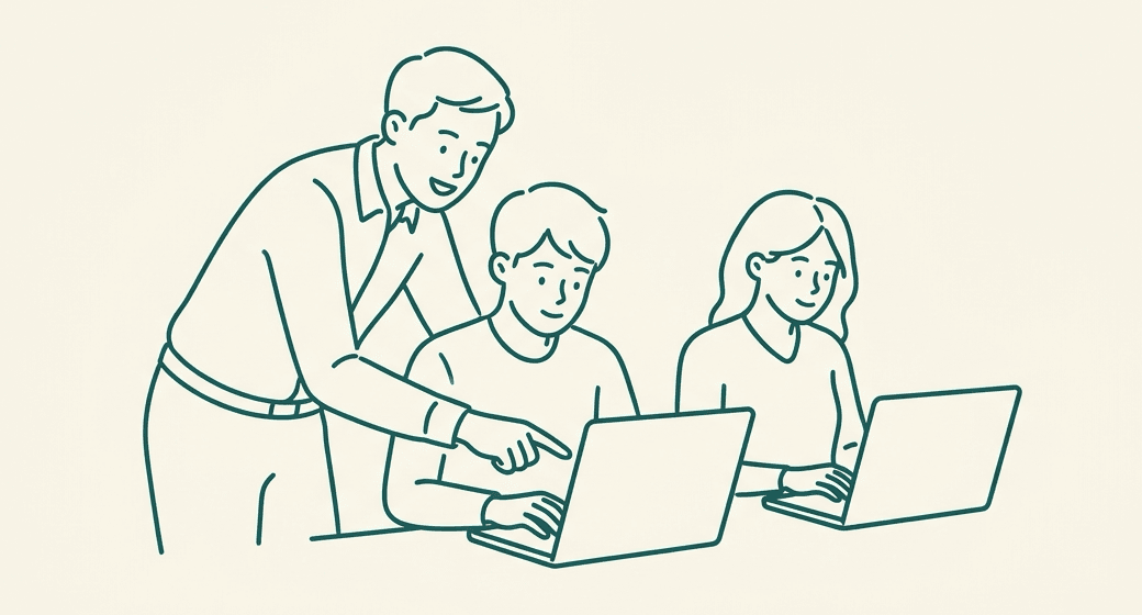 講師が受講者の隣で、ノートPCの画面を指さして教えているイラスト